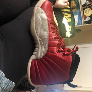 Red and white Jordan 12’s, size 11 in men’s.